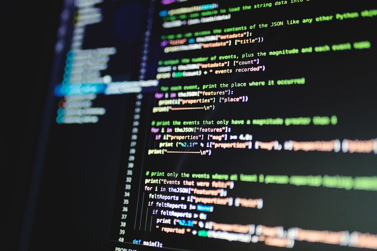 Mastering the First Impression: Your intriguing post title goes here Close-up of colorful programming code displayed on a computer monitor with a dark background.